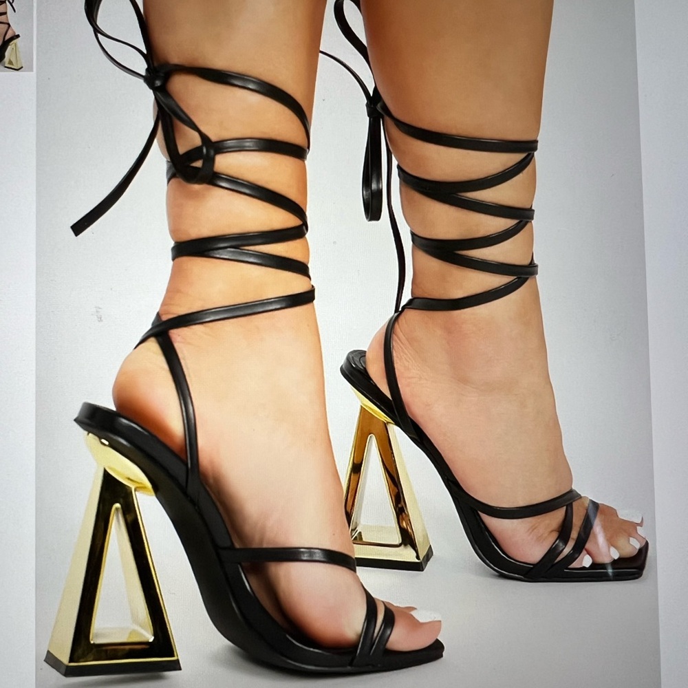 FASHION NOVA STAY WINNING WRAP UP HEELS ‎ IN BLACK GOLD NOVELTY HEELS